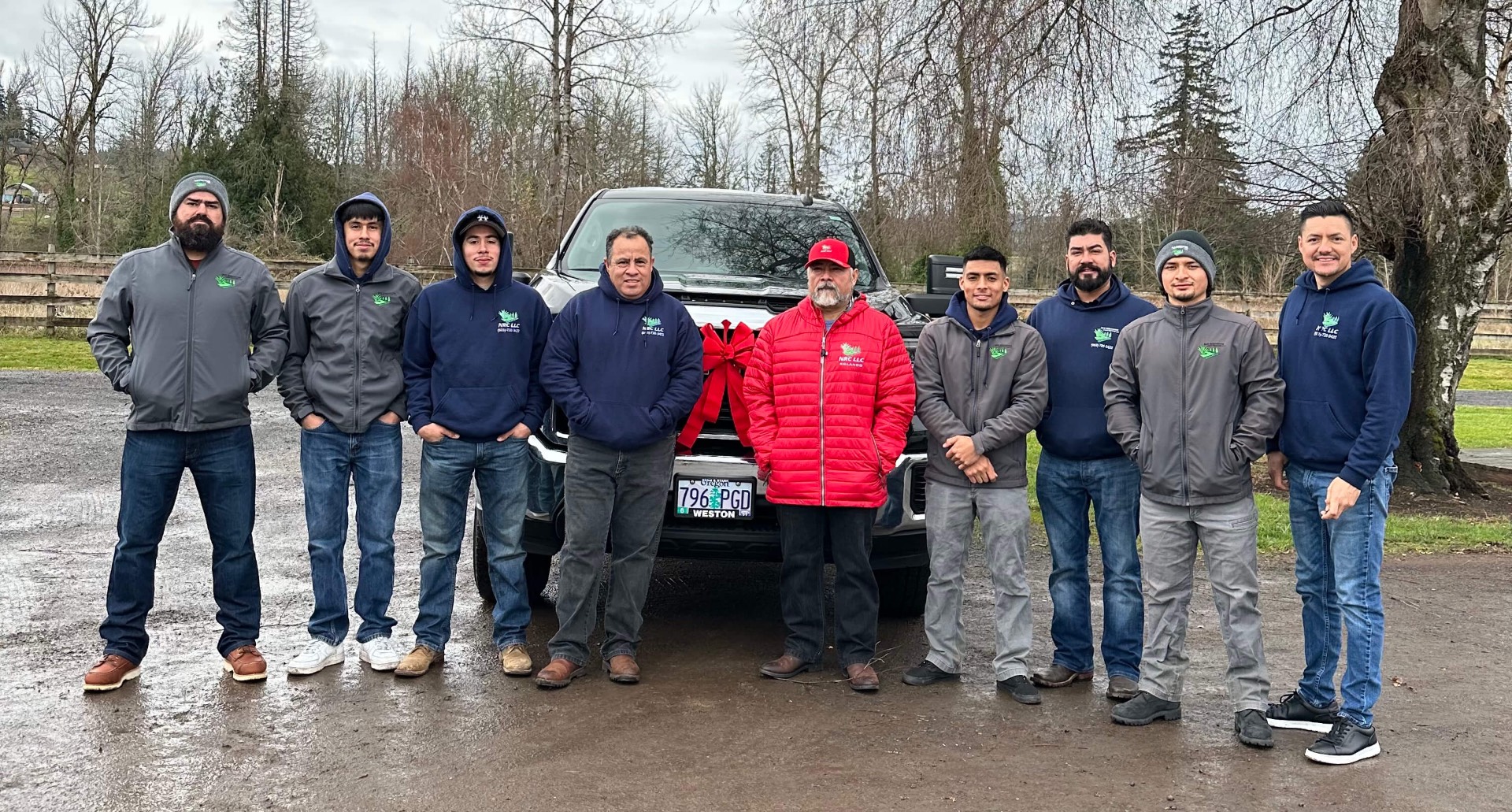 The full New Renovation Construction crew standing together outdoors.