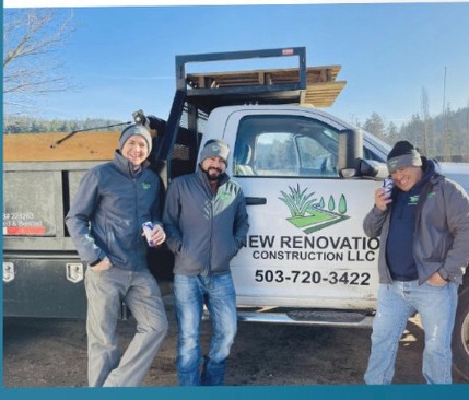 Carlos, Alberto and Esteban — the owners of New Renovation Construction LLC — standing in front of the company truck.