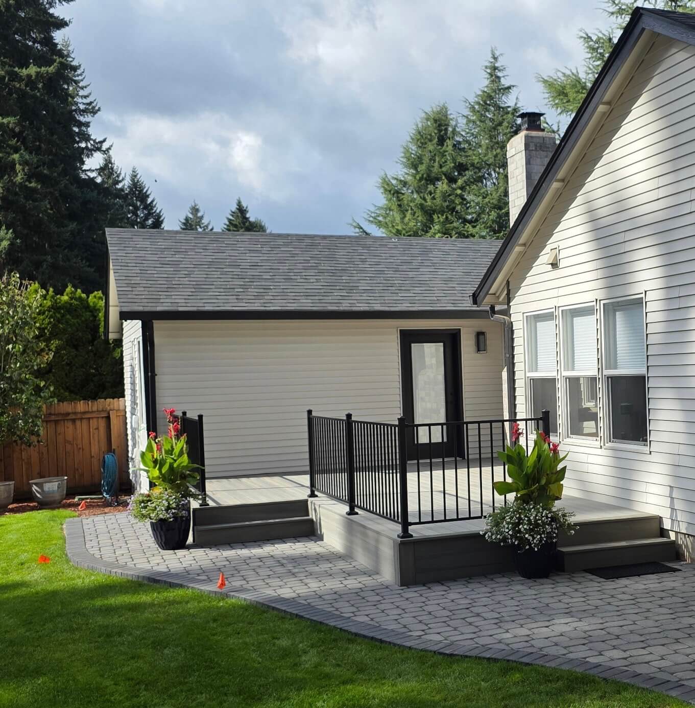 Paver patio & deck with custom railings