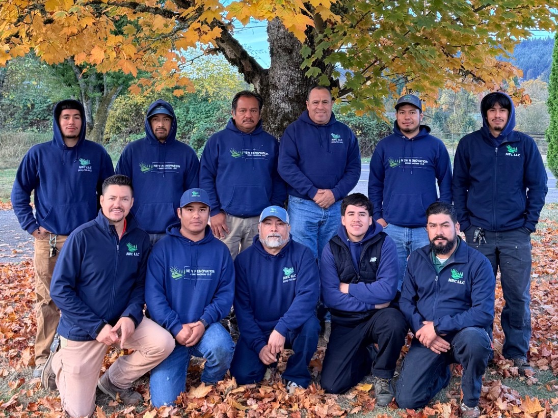 The full New Renovation Construction crew standing together outdoors.